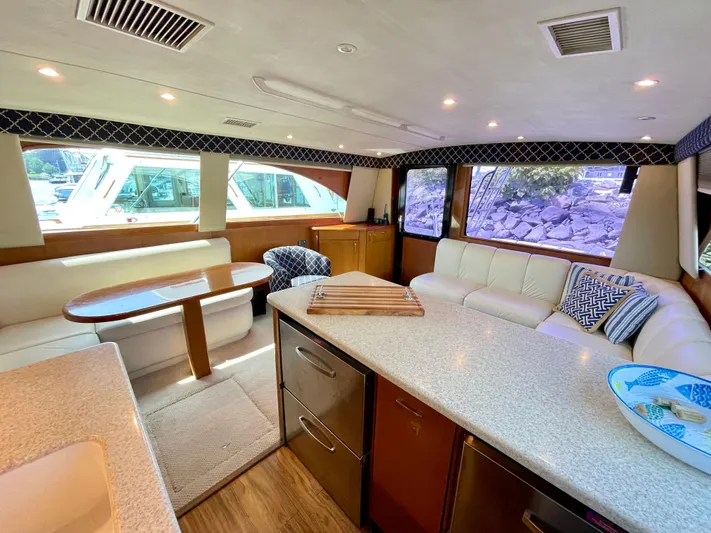  Yacht Photos Pics Luxurious interior of 2000 Ocean Yachts 43 Super Sport with modern seating and dining area.