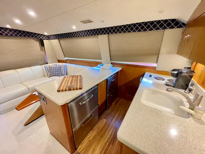  Yacht Photos Pics Luxurious interior of 2000 Ocean Yachts 43 Super Sport with modern kitchen and seating area.