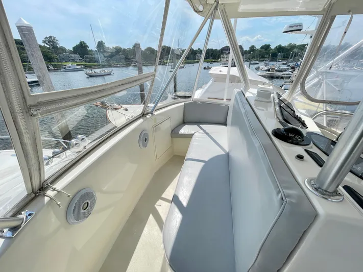  Yacht Photos Pics 2000 Ocean Yachts 43 Super Sport interior with seating, overlooking marina.