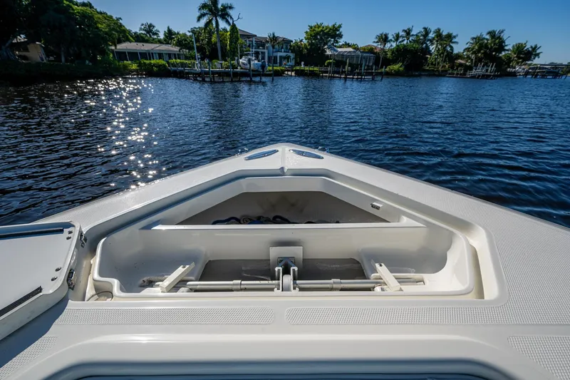  Yacht Photos Pics Bow view of 2017 SeaVee 390Z boat on a sunny day, near a waterfront.