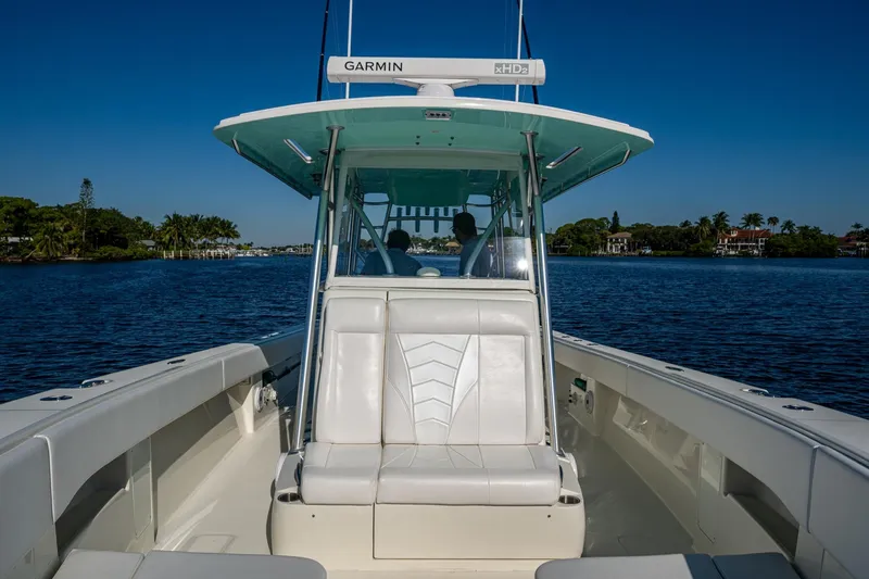  Yacht Photos Pics 2017 SeaVee 390Z boat on calm water, featuring Garmin equipment and sleek seating.