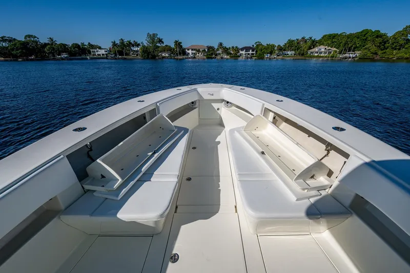  Yacht Photos Pics 2017 SeaVee 390Z boat interior with open seating, on calm water, under clear blue sky.