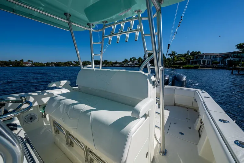  Yacht Photos Pics 2017 SeaVee 390Z boat interior with seating, overlooking calm waters and shoreline.
