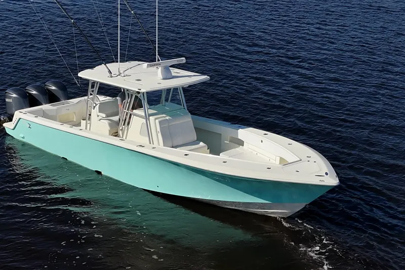  Yacht Photos Pics 2017 SeaVee 390Z boat on water, featuring triple outboard engines.