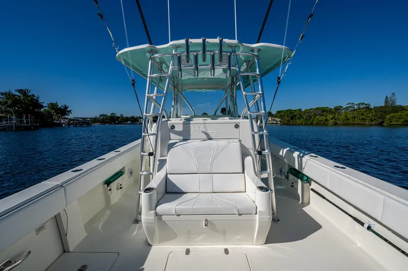  Yacht Photos Pics 2017 SeaVee 390Z boat with white seating, on a calm waterway under clear blue skies.