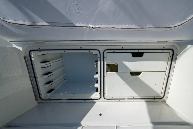  Yacht Photos Pics Storage compartments on a 2017 SeaVee 390Z boat, featuring organized shelving and drawers.