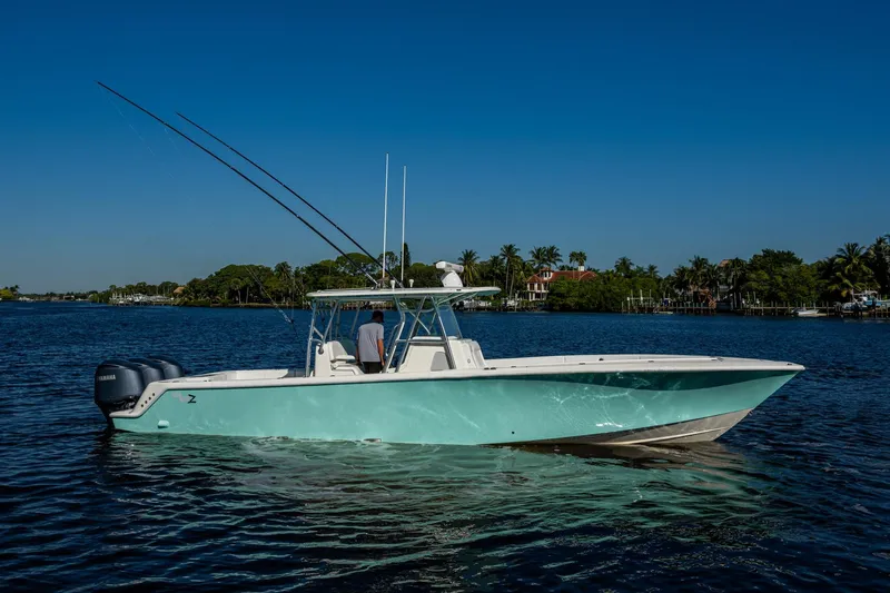  Yacht Photos Pics 2017 SeaVee 390Z boat on calm water under clear blue sky.