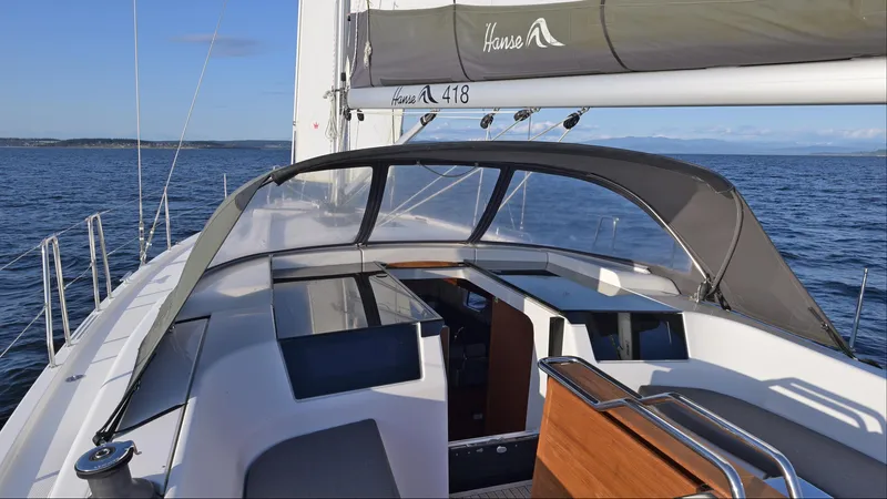 Dragon Fly Yacht Photos Pics 2019 Hanse 418 sailboat cockpit with canopy on open water.