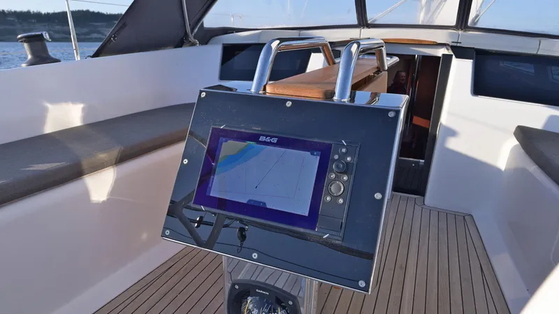 Dragon Fly Yacht Photos Pics 2019 Hanse 418 yacht cockpit with navigation system and wooden deck.