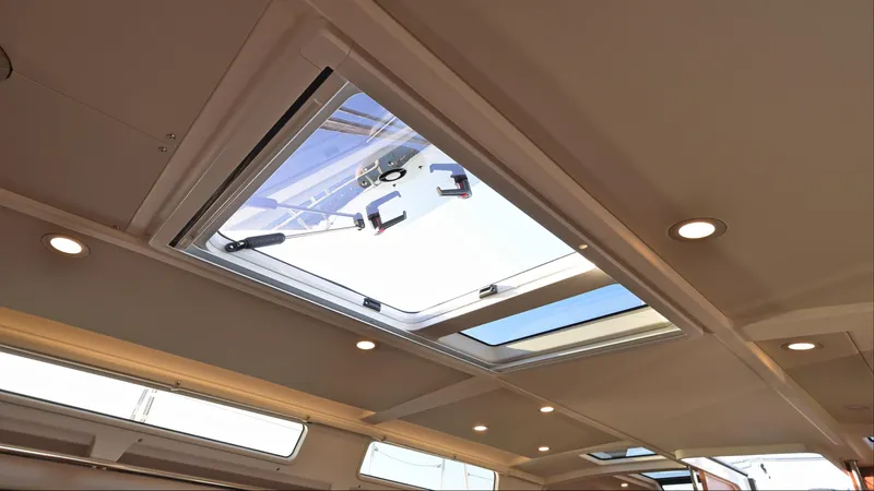 Dragon Fly Yacht Photos Pics Interior view of 2019 Hanse 418 yacht skylight with recessed lighting.