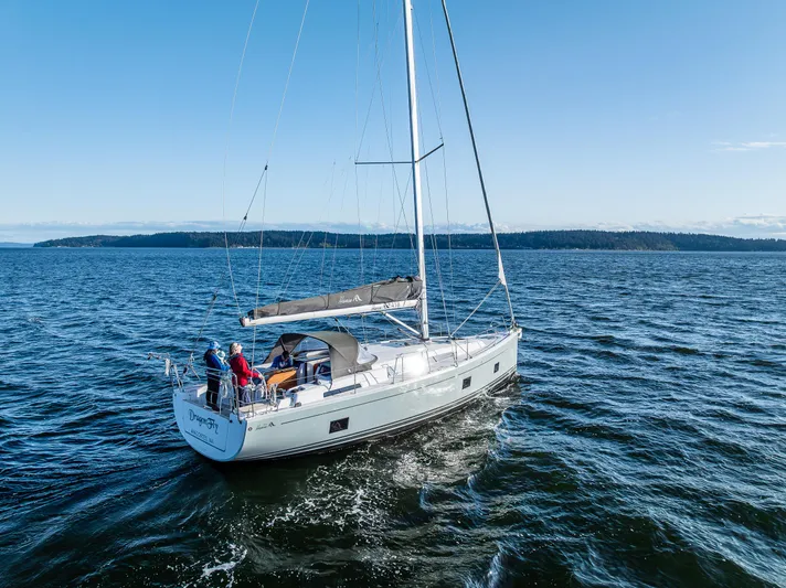 Dragon Fly Yacht Photos Pics 2019 Hanse 418 sailboat cruising on open water under clear blue skies.