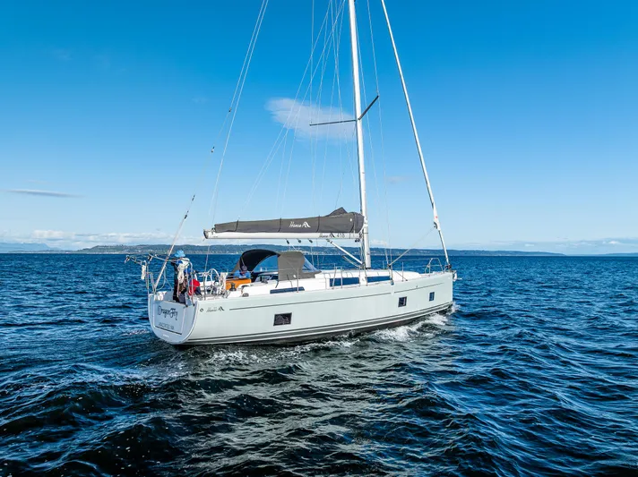 Dragon Fly Yacht Photos Pics 2019 Hanse 418 sailboat cruising on open sea under clear blue sky.