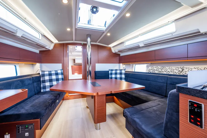 Dragon Fly Yacht Photos Pics Luxurious interior of 2019 Hanse 418 yacht with modern seating and skylight.