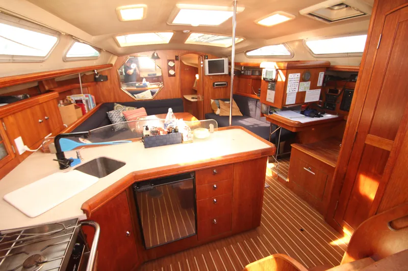 Solimar Yacht Photos Pics Interior of 2005 Hunter 41 AC sailboat with wood finish and modern amenities.