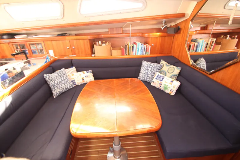 Solimar Yacht Photos Pics Luxurious interior of 2005 Hunter 41 AC yacht with cozy seating and wooden table.