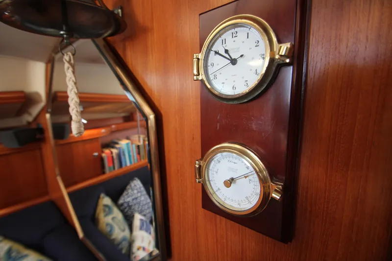 Solimar Yacht Photos Pics Interior of 2005 Hunter 41 AC yacht with clock and barometer on wooden panel.