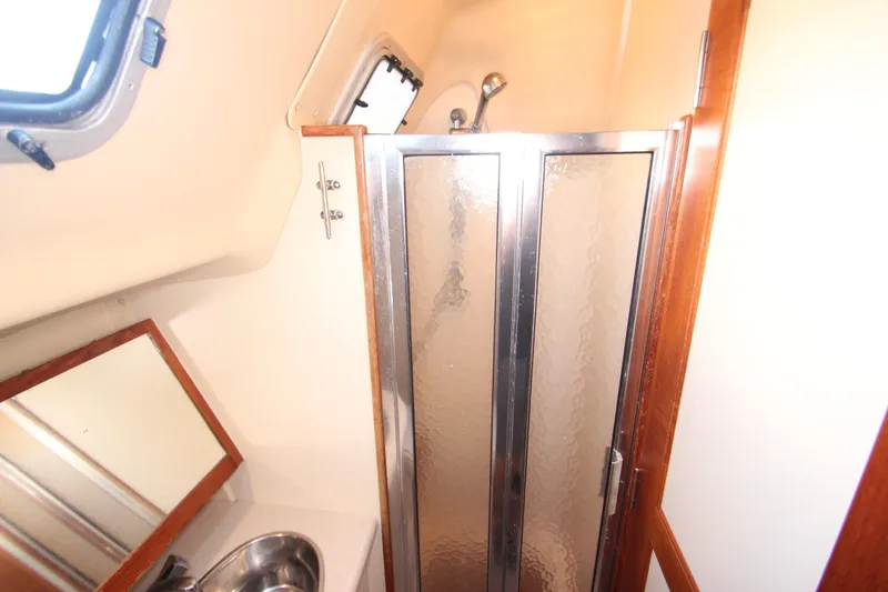Solimar Yacht Photos Pics Bathroom interior of 2005 Hunter 41 AC yacht with shower and sink.