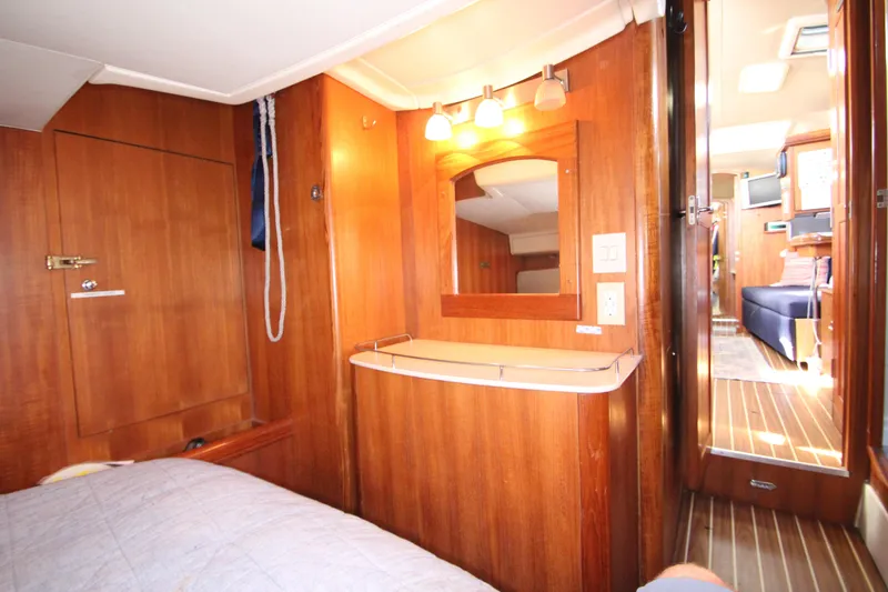 Solimar Yacht Photos Pics Interior of 2005 Hunter 41 AC yacht with wooden cabinetry and cozy lighting.