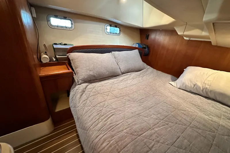 Solimar Yacht Photos Pics Cozy cabin interior of 2005 Hunter 41 AC sailboat with comfortable bedding.
