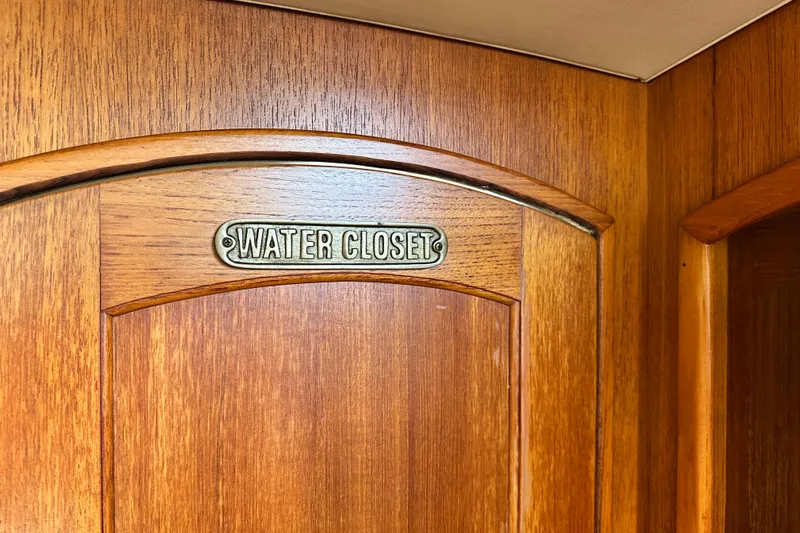 Solimar Yacht Photos Pics Wooden door with "Water Closet" sign on a 2005 Hunter 41 AC boat.