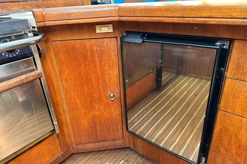 Solimar Yacht Photos Pics Wooden interior of 2005 Hunter 41 AC yacht with built-in fridge and oven.