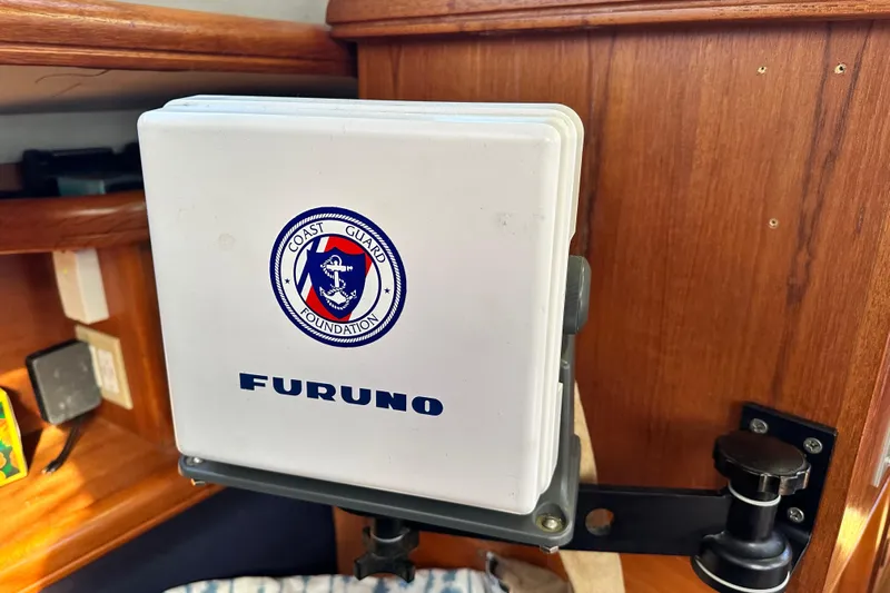 Solimar Yacht Photos Pics Furuno device with Coast Guard Foundation logo on 2005 Hunter 41 AC yacht.