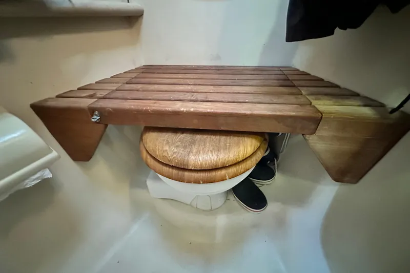 Solimar Yacht Photos Pics Wooden bench over toilet in 2005 Hunter 41 AC boat bathroom.