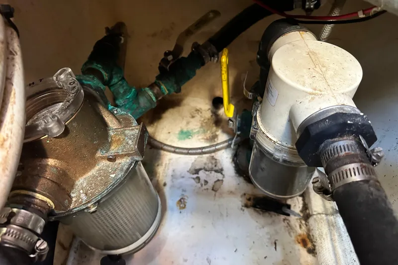 Solimar Yacht Photos Pics Engine compartment of a 2005 Hunter 41 AC sailboat, showing filters and hoses.