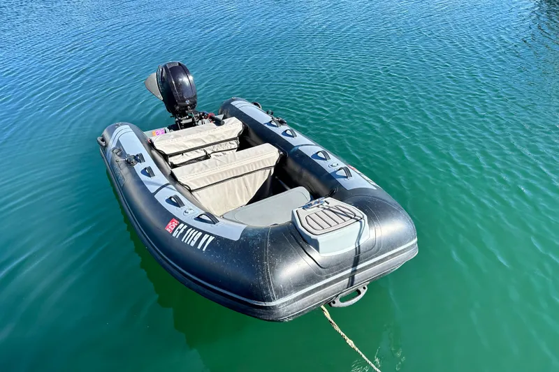 Solimar Yacht Photos Pics Inflatable boat with motor on calm water, Hunter 41 AC, 2005 model.