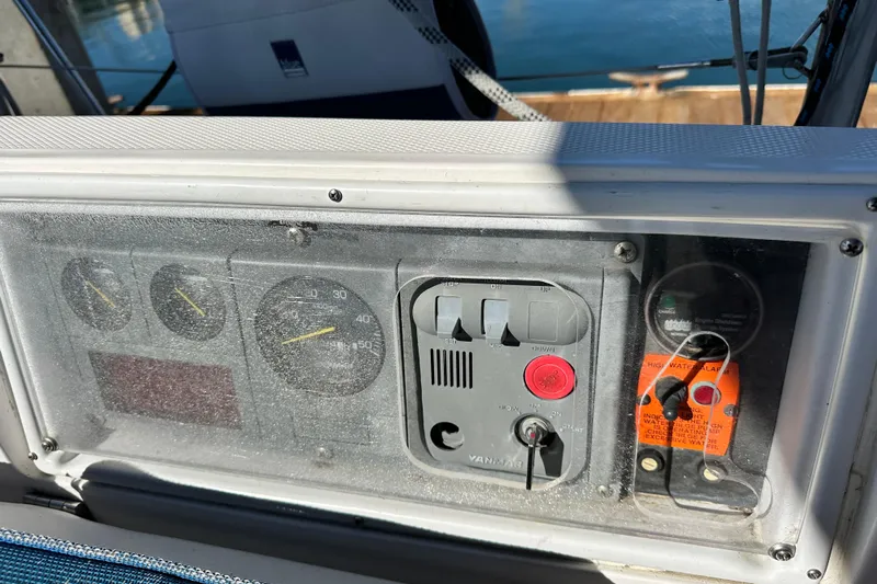 Solimar Yacht Photos Pics Control panel of a 2005 Hunter 41 AC sailboat, featuring gauges and switches.
