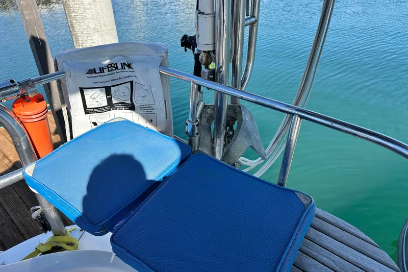 Solimar Yacht Photos Pics Deck of 2005 Hunter 41 AC sailboat with Lifesling and blue cushions.