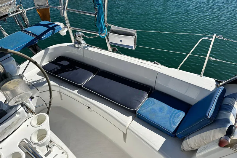 Solimar Yacht Photos Pics Cockpit seating on 2005 Hunter 41 AC sailboat with blue cushions and ocean view.