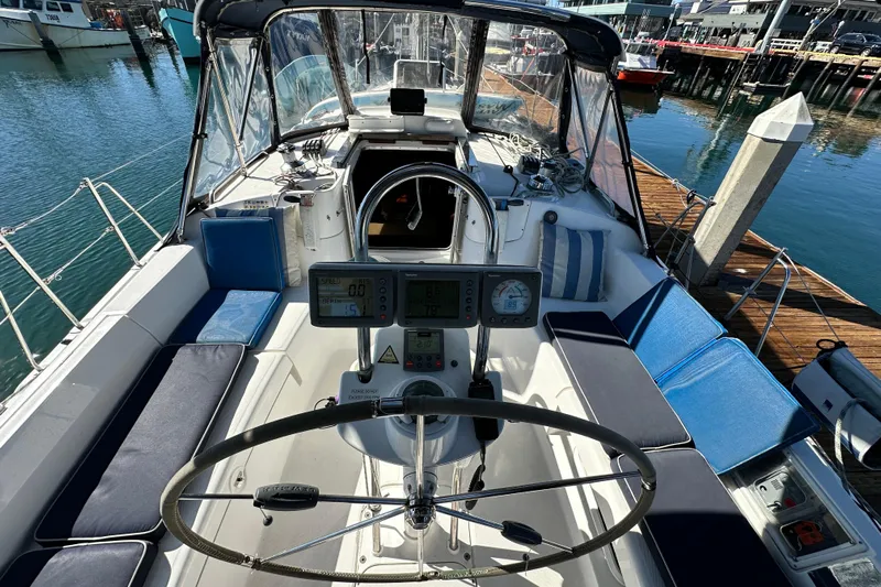 Solimar Yacht Photos Pics Cockpit of 2005 Hunter 41 AC sailboat with steering wheel and navigation instruments.