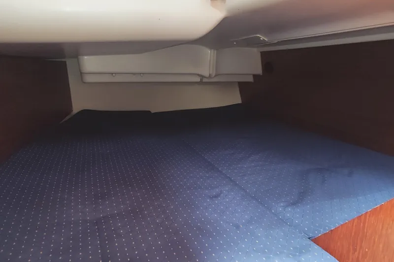  Yacht Photos Pics Interior cabin of 2005 Jeanneau Sun Odyssey 40.3 with blue bedding.