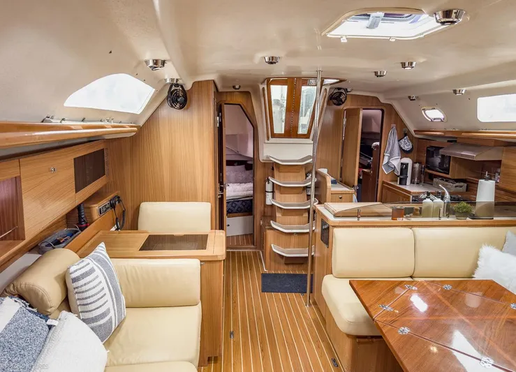 Kinship Ll Yacht Photos Pics Interior of 2010 Catalina 445 yacht, featuring wood finishes and comfortable seating.