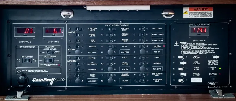 Kinship Ll Yacht Photos Pics Control panel of a 2010 Catalina 445 yacht, displaying electrical systems and voltage readings.