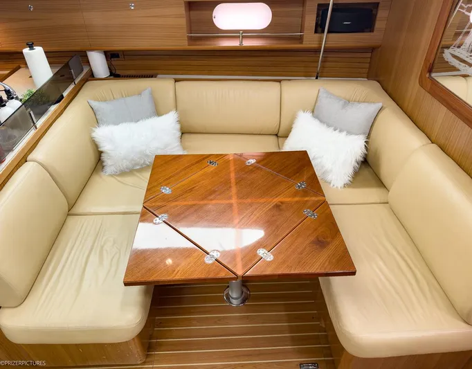 Kinship Ll Yacht Photos Pics Luxurious Catalina 445 yacht interior with beige seating and wooden table, 2010 model.