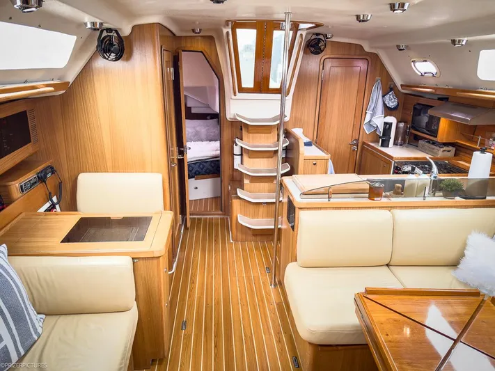 Kinship Ll Yacht Photos Pics Luxurious interior of a 2010 Catalina 445 yacht with wood finish and modern amenities.