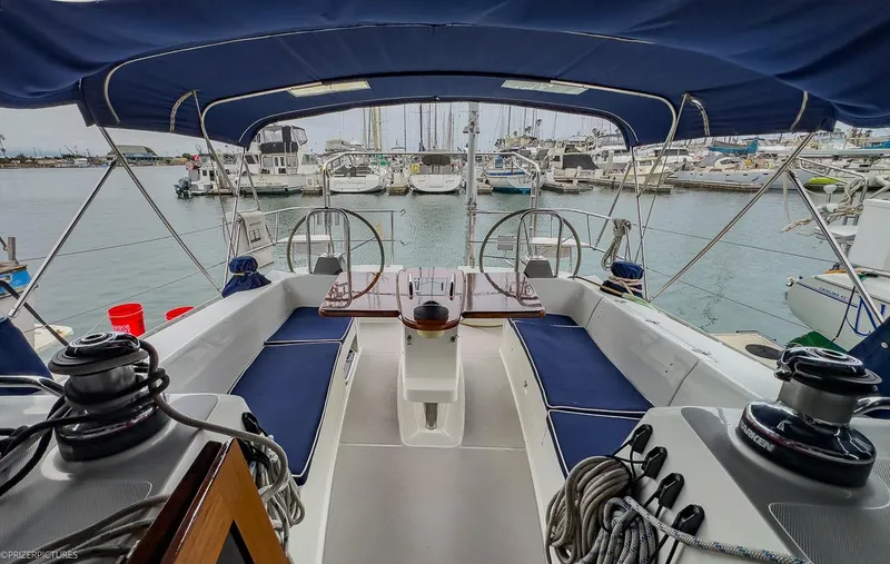 Kinship Ll Yacht Photos Pics Cockpit of 2010 Catalina 445 sailboat with blue seating, docked in marina.