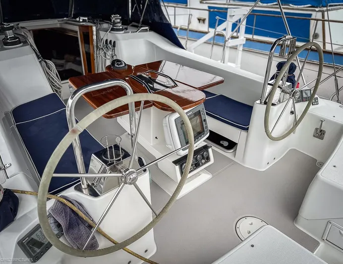 Kinship Ll Yacht Photos Pics Cockpit of a 2010 Catalina 445 sailboat with dual steering wheels and navigation equipment.