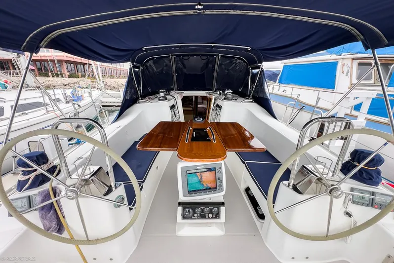 Kinship Ll Yacht Photos Pics Cockpit of 2010 Catalina 445 sailboat with dual steering wheels and navigation equipment.