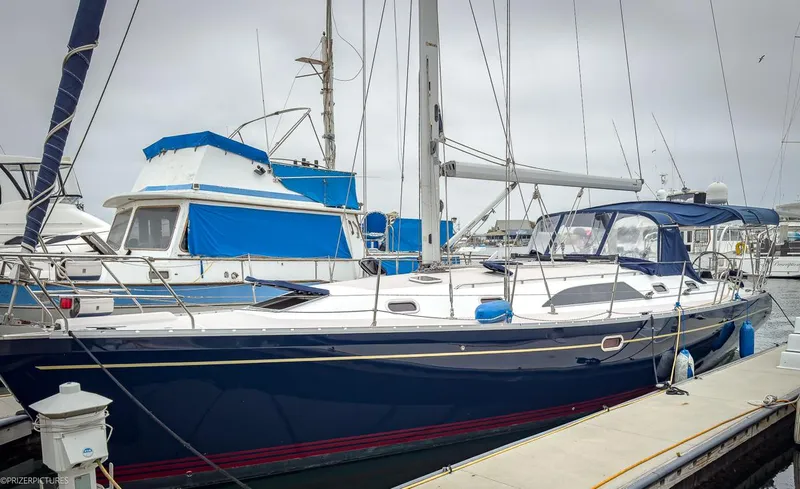 Kinship Ll Yacht Photos Pics Sailboat Catalina 445, 2010 model, docked at marina with blue and white accents.