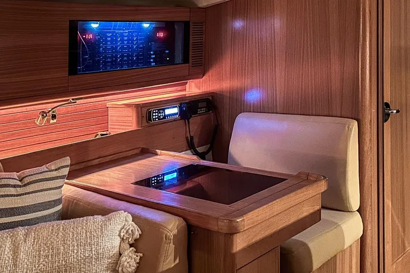 Kinship Ll Yacht Photos Pics Interior of a 2010 Catalina 445 yacht with wooden furnishings and cozy seating.