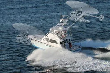  Yacht Photos Pics 1986 Ocean Yachts 55 Super Sport cruising swiftly on open water.