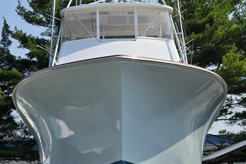  Yacht Photos Pics 1986 Ocean Yachts 55 Super Sport boat, front view with trees in background.