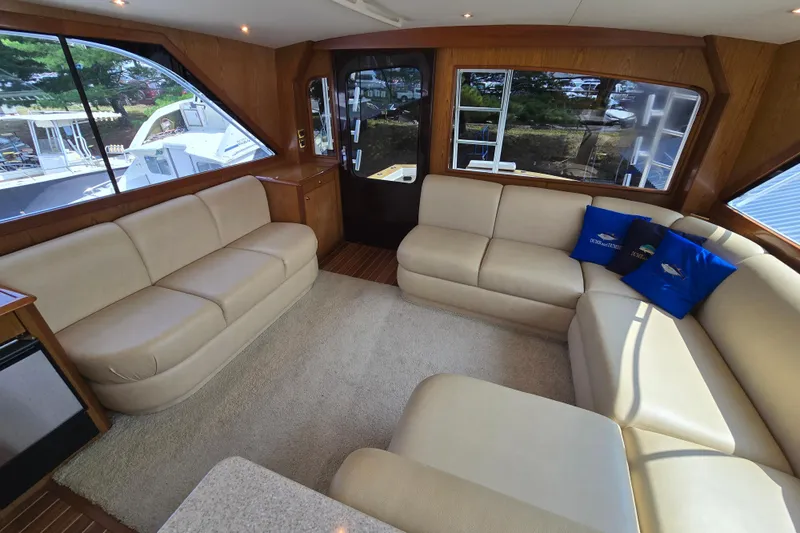 Yacht Photos Pics Luxurious interior of 1986 Ocean Yachts 55 Super Sport with beige leather seating.