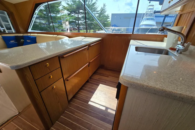  Yacht Photos Pics Interior of 1986 Ocean Yachts 55 Super Sport with wood cabinetry and countertops.