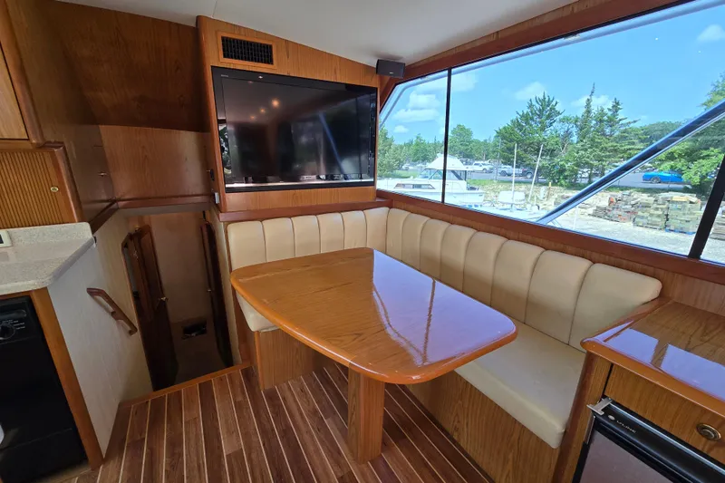  Yacht Photos Pics Interior of 1986 Ocean Yachts 55 Super Sport with dining area and large window view.