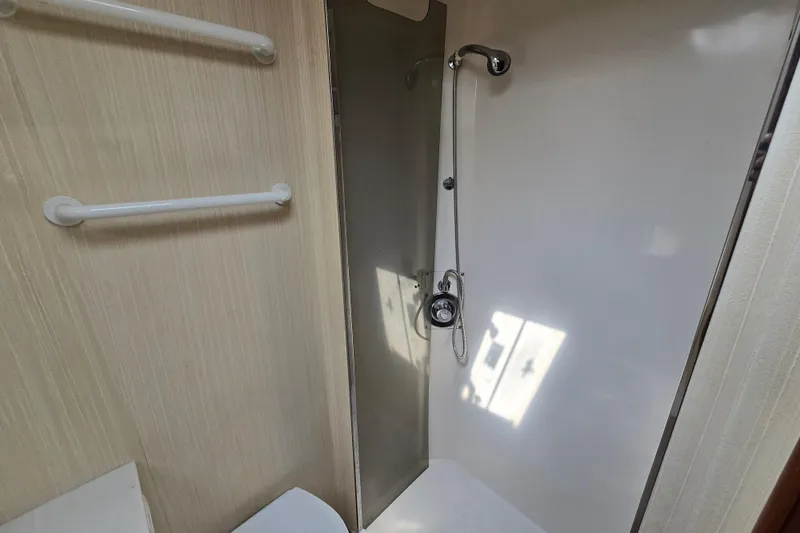  Yacht Photos Pics Shower area in 1986 Ocean Yachts 55 Super Sport, featuring sleek design and modern fixtures.