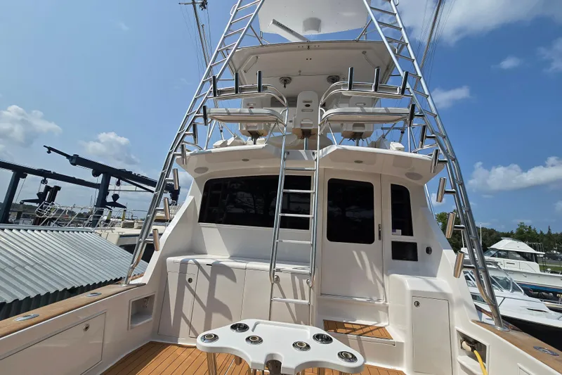  Yacht Photos Pics 1986 Ocean Yachts 55 Super Sport, rear view with ladder and fishing setup.